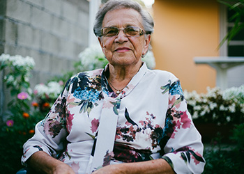 senior-woman-smiling-in-garden